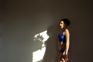 Mistress Blunt instructor of kinky bdsm yoga plays in the shadows