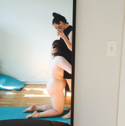 Mistress Blunt hugs a student after a kinky yoga session